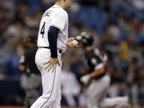 Tampa Bay Rays starting pitcher Blake Snell (4) watches as Chicago White Sox's Jose Abreu runs around the bases after Abreu his a home run during the fourth inning of a baseball game Saturday, Aug. 4, 2018, in St. Petersburg, Fla.