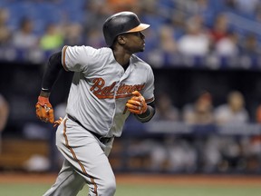 Baltimore Orioles' Tim Beckham watches his home run off Tampa Bay Rays relief pitcher Tyler Glasnow during the fourth inning of a baseball game Tuesday, Aug. 7, 2018, in St. Petersburg, Fla.