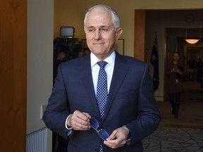 Australia's Prime Minister Malcolm Turnbull arrives for a meeting with Poland's President Andrzej Duda at Parliament House in Canberra, Monday, Aug. 20, 2018. Turnbull abandoned plans to legislate to limit greenhouse gas emissions to head off a revolt by conservative lawmakers.