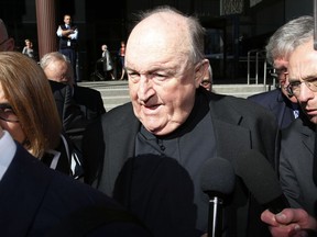 Former Adelaide Archbishop Philip Wilson leaves Newcastle Local Court, in Newcastle, Australia, after a post-sentence decision, Tuesday, Aug. 14, 2018. The most senior Roman Catholic cleric convicted of covering up child sex abuse has been ordered by an Australian court to serve his 1-year sentence in home detention rather than jail.