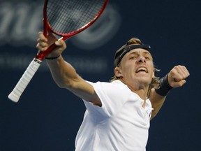 Denis Shapovalov of Canada celebrates his victory over Jeremy Chardy of France during the first round of the Rogers Cup men's tennis tournament in Toronto on Tuesday night.
