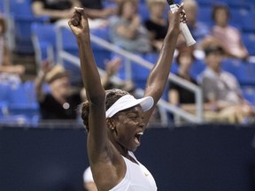 Francoise Abanda of Canada celebrates her victory over Kirsten Flipkens of Belgium during first round of play Tuesday night at the Rogers Cup tennis tournament in Montreal.