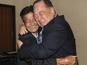 FILE - In this Aug. 20, 2018, file photo, South Korean Ham Sung-chan, 93, right, hugs his North Korean brother Ham Dong Chan, 79, during the Separated Family Reunion Meeting at the Diamond Mountain resort in North Korea. After nearly 70 years of a separation forced by a devastating 1950-53 war that killed and injured millions and cemented the division of the Korean Peninsula into North and South, Ham and his North Korean brother only got a total of 12 hours together.