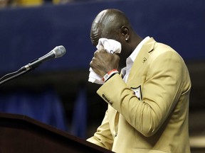 Former wide receiver Terrell Owens wipes tears as he delivers his NFL Pro Football Hall of Fame speech on Saturday, Aug. 4, 2018, in Chattanooga, Tenn. Instead of speaking at the Hall of Fame festivities in Canton, Ohio, Owens celebrated his induction at the University of Tennessee at Chattanooga, where he played football and basketball and ran track.
