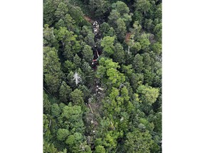 The wreckage of Gunma prefectural air rescue helicopter Haruna is seen after crashing in Nakanojo town, Gunma prefecture, northwest of Tokyo Friday, Aug. 10, 2018. The rescue helicopter has crashed in central Japan mountains hours after it lost contact and the condition of nine people aboard is not immediately clear.