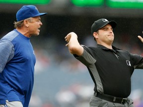 First-base umpire Jansen Visconti ejects Toronto Blue Jays manager John Gibbons from a game against the New York Yankees on Aug, 19.