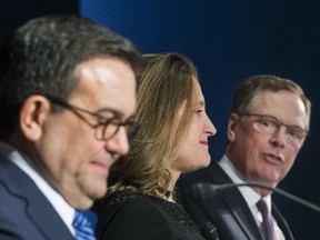 Foreign Affairs Minister Chrystia Freeland and Mexico's Secretary of Economy Ildefonso Guajardo Villarrea look on as United States Trade Representative Robert Lighthizer delivers his statements to the media during the sixth round of negotiations for a new North American Free Trade Agreement in Montreal, Monday, January 29, 2018