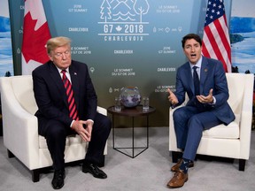 In this file photo taken on June 08, 2018, US President Donald Trump and Canadian Prime Minister Justin Trudeau hold a meeting on the sidelines of the G7 Summit in La Malbaie, Quebec, Canada. - Canada and the United States faced roadblocks as they went down to the wire Friday, August 31, 2018, in talks to salvage the North American Free Trade Agreement, and one may have come from dealmaker-in-chief Donald Trump.