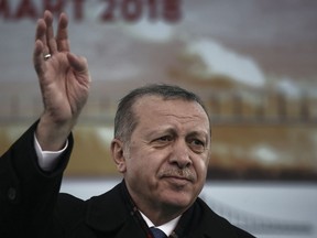 Turkish President Recep Tayyip Erdogan waves to supporters during a ceremony on March 18, 2018. MUST CREDIT: Bloomberg photo by Kostas Tsironis.