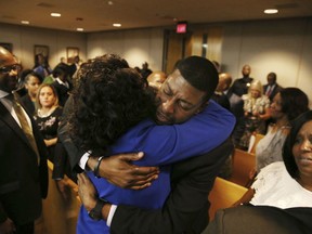Odell Edwards, father of Jordan Edwards, gets a hug from Dallas County district attorney Faith Johnson after hearing a guilty of murder verdict during the ninth day of the trial of fired Balch Springs police officer Roy Oliver, who was charged with the murder of 15-year-old Jordan Edwards, at the Frank Crowley Courts Building in Dallas on Tuesday, Aug. 28, 2018.
