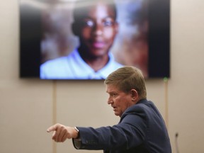 Lead prosecutor Michael Snipes points to the family of Jordan Edwards during his closing argument in the trial of former Balch Springs police officer Roy Oliver, who is charged with the murder of 15-year-old Jordan Edwards, at the Frank Crowley Courts Building in Dallas on Monday, Aug. 27, 2018.