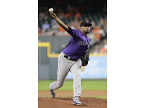 Colorado Rockies starting pitcher German Marquez throws against the Houston Astros during the first inning of a baseball game Tuesday, Aug. 14, 2018, in Houston.