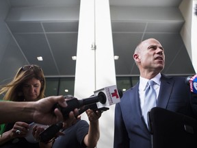 Attorney Michael Avenatti talks to the media Tuesday, Aug. 14, 2018, in Houston. Avenatti, the attorney taking on President Donald Trump on behalf of adult film star Stormy Daniels, offered some details on his policy views Tuesday as he weighs an outsider Democratic bid for the White House.