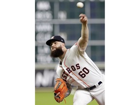 Houston Astros starting pitcher Dallas Keuchel (60) throws against the Oakland Athletics during the first inning of a baseball game Wednesday, Aug. 29, 2018, in Houston.