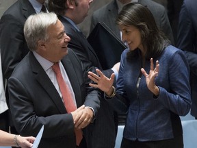 United Nations Secretary-General Antonio Guterres, left, talks to American Ambassador to the United Nations Nikki Haley before a Security Council meeting on threats to international peace and security caused by terrorist acts, Thursday, Aug. 23, 2018 at United Nations headquarters.
