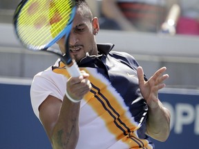 Nick Kyrgios, of Australia, returns a shot to Pierre-Hugues Herbert, of France, during the second round of the U.S. Open tennis tournament, Thursday, Aug. 30, 2018, in New York.