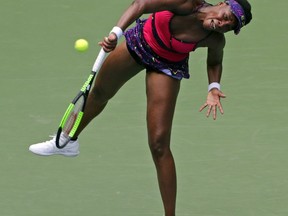 Venus Williams serves to Camila Giorgi, of Italy, during the second round of the U.S. Open tennis tournament, Wednesday, Aug. 29, 2018, in New York.