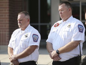 Draper Battalion Chiefs Bart Vawdrey and Kevin Holt listen during a press conference in Draper, Utah, on Tuesday, Aug. 14, 2018. Draper Battalion Chief Matthew Burchett died battling the largest recorded wildfire in California history.