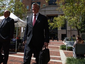 Kevin Downing, a lawyer for Paul Manafort, leaves the Albert V. Bryan United States Courthouse during a break in the trial of the former Trump campaign chairman, Friday, Aug. 10, 2018, in Alexandria, Va.