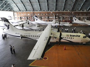 In this photo provided by Tasnim News Agency, Iran Air's new commercial aircrafts are parked at Mehrabad airport in Tehran, Iran, Sunday, Aug. 5, 2018. Iran has acquired five new ATR72-600 airplanes from ATR, jointly owned by European consortium Airbus and Italy's Leonardo, a day before the U.S. begins restoring sanctions suspended under the 2015 nuclear deal.