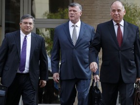 Members of the defense team for Paul Manafort, including Richard Westling, left, Kevin Downing, Thomas Zehnle, walk to federal court as jury deliberations begin in the trial of the former Trump campaign chairman, in Alexandria, Va., Thursday, Aug. 16, 2018.
