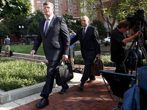 Kevin Downing, left, and Thomas Zehnle, the attorneys for Paul Manafort, arrive for the trial of former Trump campaign chairman Paul Manafort as it continues in federal court in Alexandria, Va., Tuesday, Aug. 7, 2018.