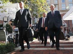 Members of the defense team for Paul Manafort, from left, Kevin Downing, Richard Westling, and Thomas Zehnle, walk to federal court for closing arguments in the trial of the former Trump campaign chairman, in Alexandria, Va., Wednesday, Aug. 15, 2018.