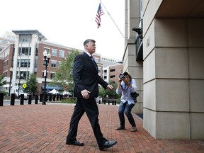 Kevin Downing, left, with the defense team for Paul Manafort, walks into federal court for jury deliberations in the trial of the former Trump campaign chairman, in Alexandria, Va., Tuesday, Aug. 21, 2018.
