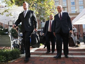 Members of the defense team for Paul Manafort, from left, Kevin Downing, Richard Westling, and Thomas Zehnle, walk to federal court for closing arguments in the trial of the former Trump campaign chairman, in Alexandria, Va., Wednesday, Aug. 15, 2018.