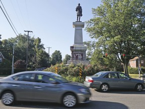 Cars pass by a statue of Confederate General A. P. Hill that was vandalized overnight in Richmond, Va., Wednesday, Aug. 22, 2018. Richmond has been debating what to do with its most prominent Confederate monuments along Monument Avenue in a different part of the city. The Hill statue hasn't been part of that discussion.