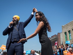 NDP Leader Jagmeet Singh, left, stands with his wife Gurkiran Kaur Sidhu after announcing he will run in a byelection in Burnaby South, during an event at an outdoor film studio, in Burnaby, B.C., on Wednesday August 8, 2018.