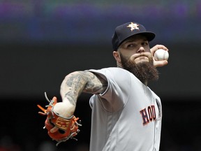 Houston Astros starting pitcher Dallas Keuchel throws against the Seattle Mariners in the first inning of a baseball game Wednesday, Aug. 1, 2018, in Seattle.