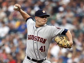Houston Astros starting pitcher Brad Peacock throws against the Seattle Mariners during the first inning of a baseball game, Tuesday, Aug. 21, 2018, in Seattle.