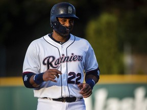 Robinson Cano smiles on the field during his first rehab start with the Tacoma Rainiers at Cheney Stadium in Tacoma, Wash., Monday, Aug. 6, 2018. Cano is beginning a rehab assignment with the Seattle Mariners' Triple-A affiliate as he prepares for his return from his 80-game suspension for violating baseball's joint drug agreement.