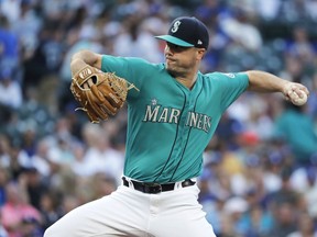 Seattle Mariners starting pitcher Wade LeBlanc throws to a Los Angeles Dodgers batter during the first inning of a baseball game Friday, Aug. 17, 2018, in Seattle.