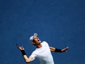 Andy Murray serves to Lucas Pouille at the Western and Southern Open in Mason, Ohio, on Aug. 13.