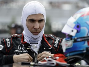 Robert Wickens prepares to qualify for Sunday's IndyCar series auto race, Saturday, Aug. 18, 2018, in Long Pond, Pa. The 29-year-old Canadian driver was attempting to pass Ryan Hunter-Reay when the two cars slightly touched. That caused Hunter-Reay’s car to careen into the wall and Wickens’ car was pulled along for the ride.