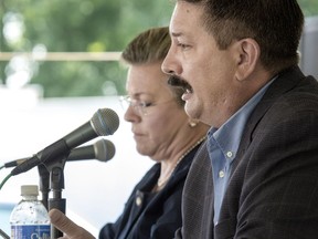 FILE - In this Wednesday, July 25, 2018, file photo, Randy Bryce answers a question during a debate with his opponent, Cathy Myers, at the Rock County 4-H Fair in Janesville, Wis. House Speaker Paul Ryan's retirement creates an opening in his southeastern Wisconsin congressional district for the first time in 20 years, fueling hopes among Democrats that they can pick up the seat that leans Republican.