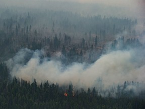 The Shovel Lake wildfire burns near the Nadleh Whut'en First Nation in Fort Fraser, B.C., on Thursday August 23, 2018. Rain fell and temperatures cooled in many parts of British Columbia over the weekend, reducing wildfire risk but not bringing as much relief as needed to crews battling hundreds of blazes in the province.