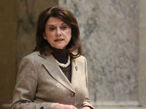 FILE - In this Nov. 7, 2017, file photo, Wisconsin state Sen. Leah Vukmir stands in the Senate chambers at the state Capitol in Madison. Vukmir, a Wisconsin state senator and close ally to Gov. Scott Walker, defeated a former Marine who cast himself as a political outsider to win the Republican primary for U.S. Senate on Tuesday, Aug. 14, 2018.