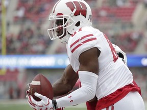 In this Nov. 4, 2017, photo, Wisconsin wide receiver Quintez Cephus (87) catches a pass for a touchdown during the second quarter of an NCAA college football game against Indiana in Bloomington, Ind. Cephus says he's taking a leave of absence from the team because he believes prosecutors intend to file criminal charges against him for an incident in April involving what he calls a "consensual relationship." In a tweet late Saturday, Aug. 18, 2018, Cephus didn't specify what he is accused of but denied any wrongdoing and said he has been wrongfully accused.