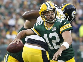 Green Bay Packers' Aaron Rodgers throws during the first half of a preseason NFL football game against the Pittsburgh Steelers Thursday, Aug. 16, 2018, in Green Bay, Wis.