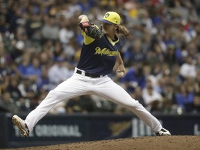 Milwaukee Brewers relief pitcher Josh Hader throws during the sixth inning of a baseball game against the Pittsburgh Pirates Friday, Aug. 24, 2018, in Milwaukee.