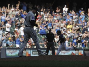 Colorado Rockies relief pitcher Adam Ottavino reacts after giving upon a home run to Milwaukee Brewers' Mike Moustakas during the ninth inning of a baseball game Sunday, Aug. 5, 2018, in Milwaukee.