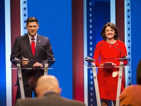FILE - In this July 26, 2018, file photo, Republican U.S. Senate candidates Leah Vukmir, right, and Kevin Nicholson debate in Milwaukee. Nicholson, running as an outsider, is running against Vukmir, a 15-year veteran of the Legislature who had the state GOP endorsement. The Republican primary battle for a Wisconsin U.S. Senate seat pits two loyalists to President Donald Trump who agree on most of the issues.