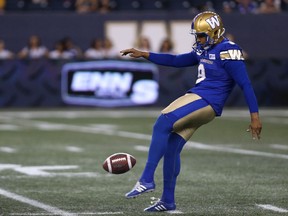 Winnipeg Blue Bombers punter Justin Medlock kicks against the Edmonton Eskimos on Thursday, June 14, 2018.