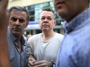 In this July 25, 2018 photo, Andrew Craig Brunson, an evangelical pastor from Black Mountain, North Carolina, arrives at his house in Izmir, Turkey.   Brunson, who had been jailed in Turkey for more than one and a half years on terror and espionage charges was released and will be put under house arrest as his trial continues.  The White House is announcing that the Treasury Department is imposing sanctions on two Turkish officials over a detained American pastor who is being tried on espionage and terror-related charges.