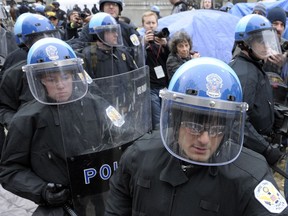 FILE - In this Feb. 4, 2012 file photo, U.S. Park Police are seen working in riot gear in Washington.  Government and police officials in the nation's capital say they are confident the city can manage to host this weekend's planned white nationalist rally without violence. A small rally will take place Sunday in front of the White House and the participants may be dwarfed by larger counter-protests with police keeping the two sides apart.