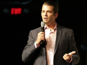 FILE - In this July 18, 2018, file photo Donald Trump Jr. speaks at a rally for Florida gubernatorial candidate Rep. Ron DeSantis in Orlando, Fla. President Donald Trump remains ensconced at his New Jersey golf club, growing increasingly worried that his eldest son may be next in the special counsel's crosshairs. But Donald Trump Jr. has not let the legal scrutiny slow him down, embracing his role as his father's emissary