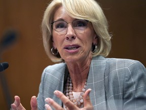 FILE - In this June 5, 2018, file photo, Education Secretary Betsy DeVos testifies during hearing on the FY19 budget on Capitol Hill in Washington. Support for charter schools and private school voucher programs has gone up over the past year, with Republicans accounting for much of the increase, according to a survey published Tuesday, Aug. 21. The findings by Education Next, a journal published by Harvard's Kennedy School and Stanford University, come as DeVos promotes alternatives to traditional public schools.